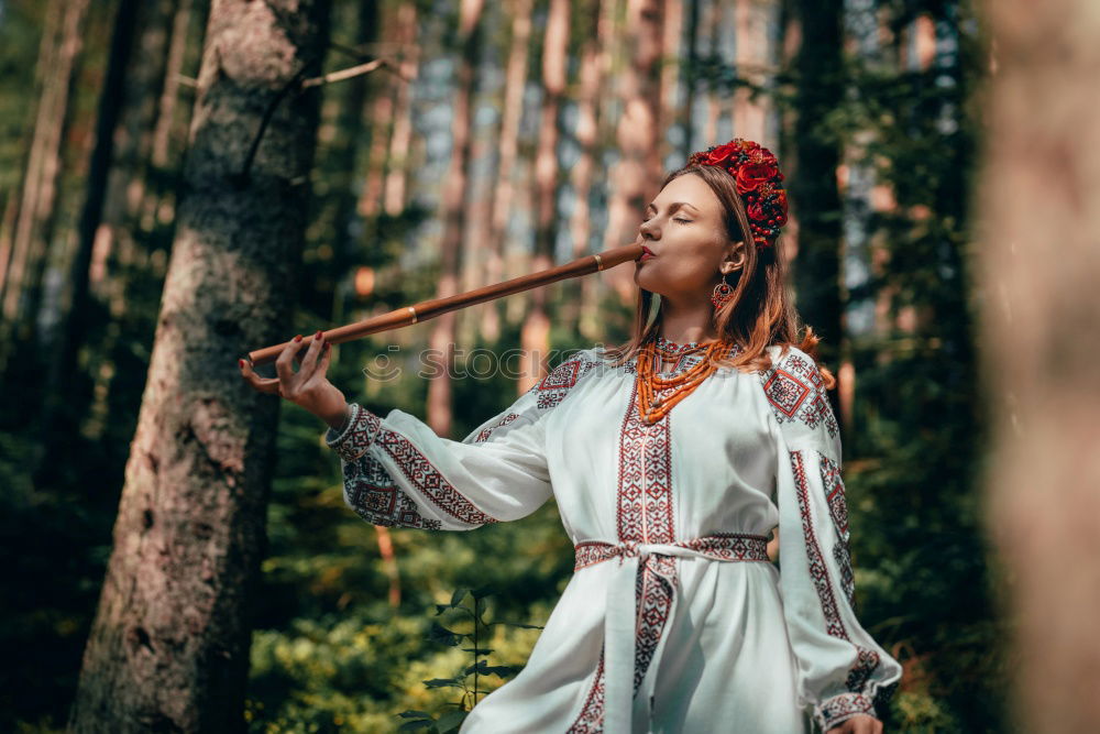 Similar – A Young Woman Standing in the Woods