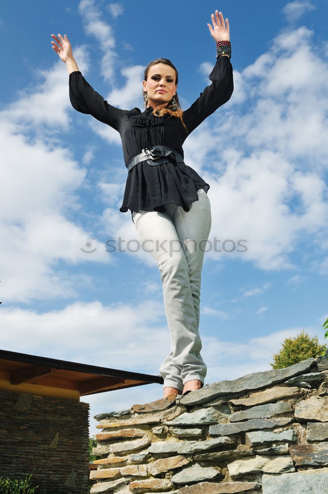 Similar – Low view of a young woman in nature