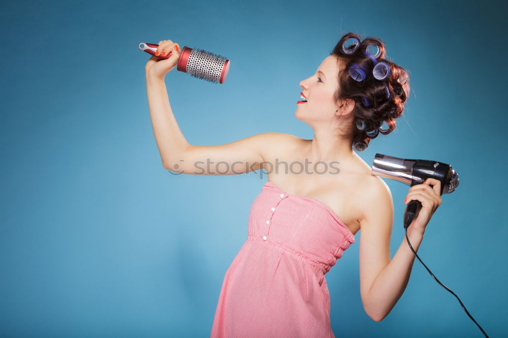 Similar – Angry young woman holding a retro clock