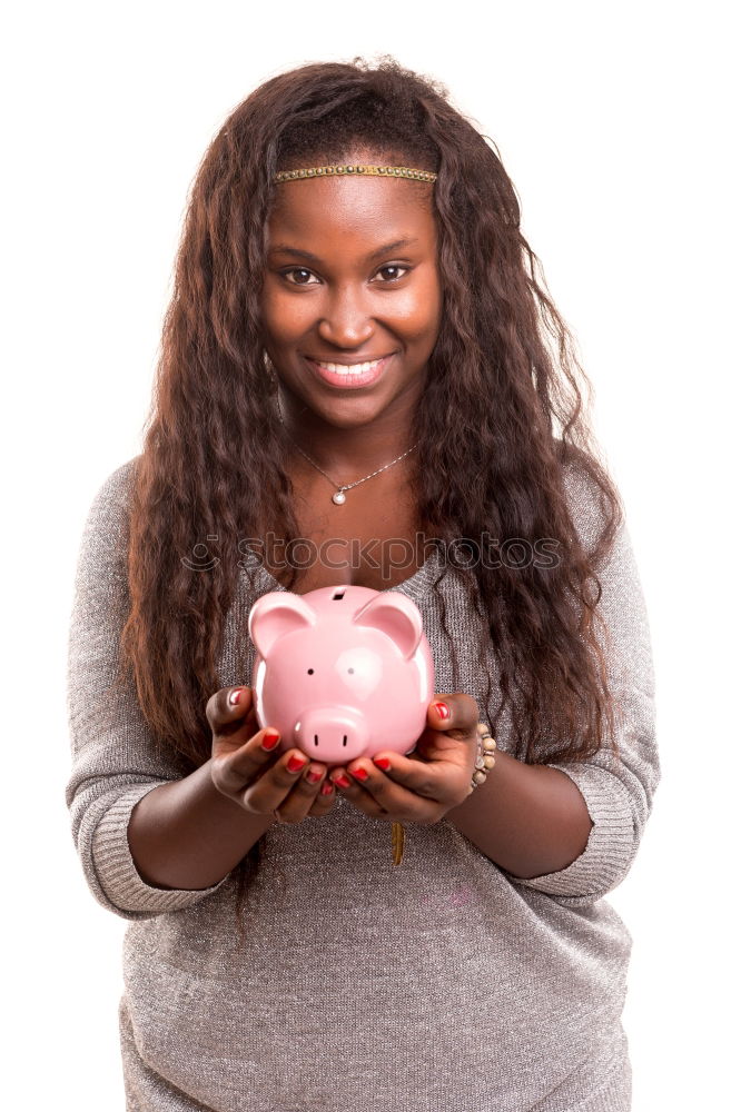 Similar – Thoughtful confused black woman with piggy bank