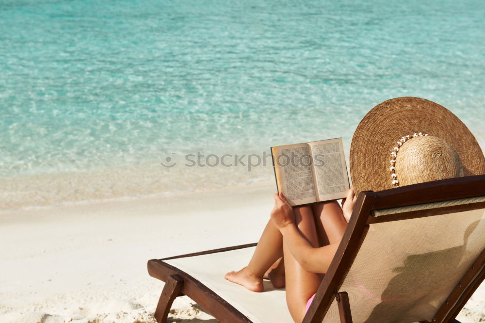 Similar – Reading on the beach Beach