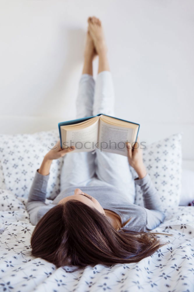 Similar – Image, Stock Photo woman reading a book and drinking coffee on bed with socks