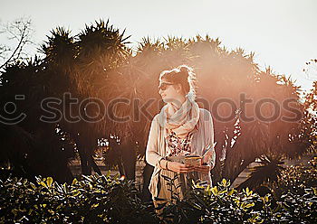 Similar – Woman lying in a deck chair