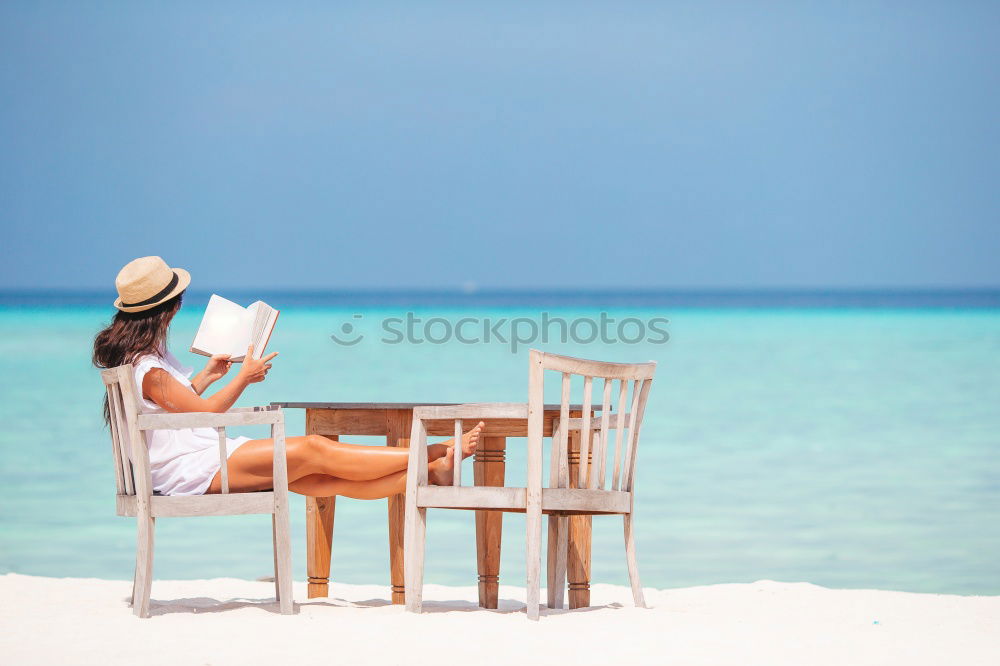 Similar – Reading on the beach Beach