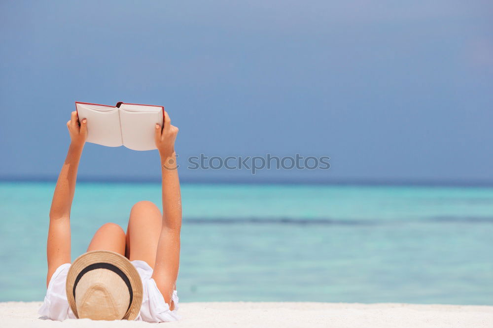 Similar – Image, Stock Photo Girl lying on a blanket and reading a book on a sunny day