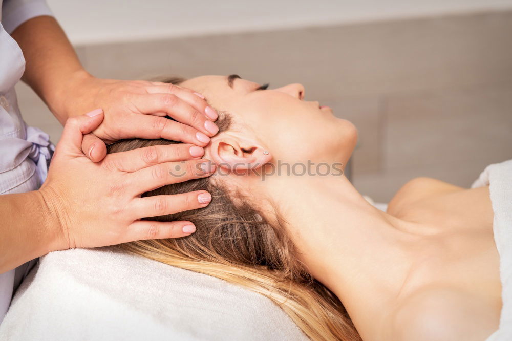 Similar – Image, Stock Photo Woman receiving back massage on clinical center