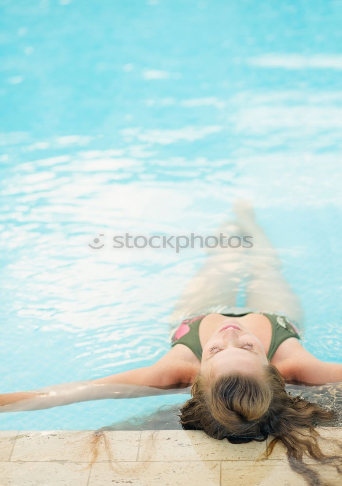 Similar – Image, Stock Photo Woman relaxing in swimming pool