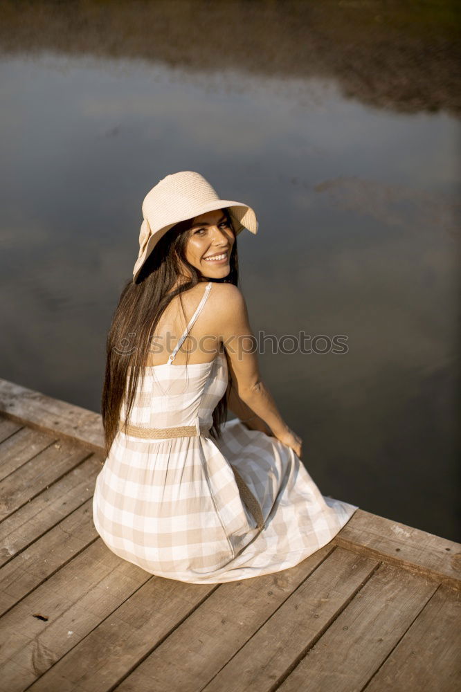 Similar – Portrait of pretty woman smiling in nature