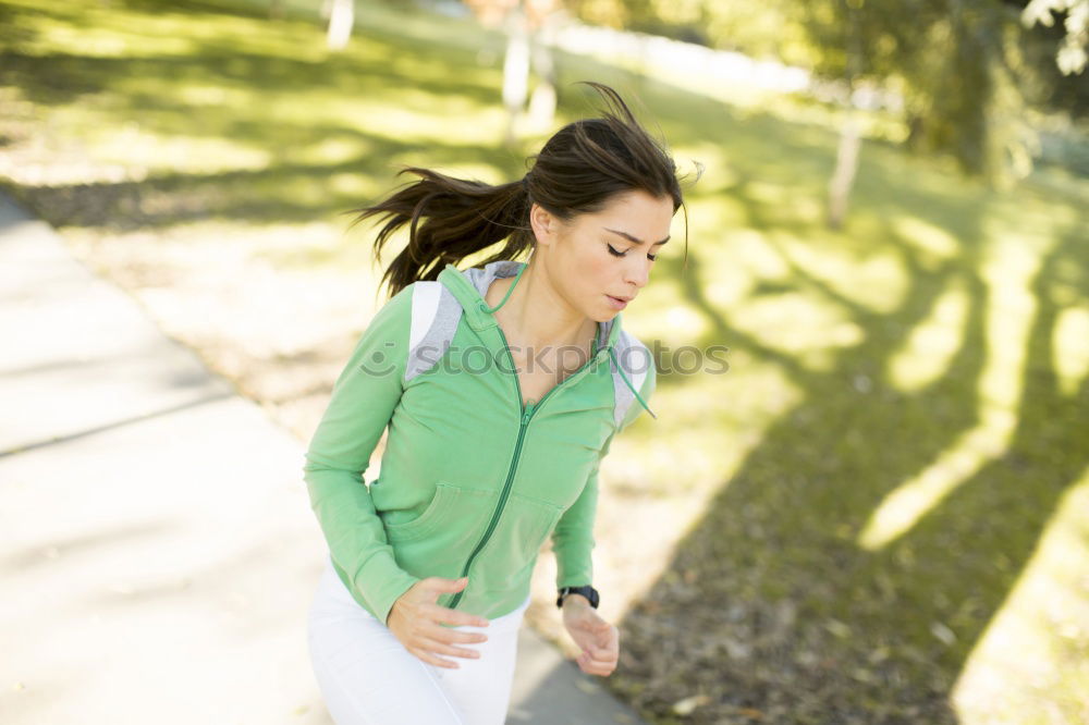 Similar – Image, Stock Photo Woman listening to music while jogging on a street
