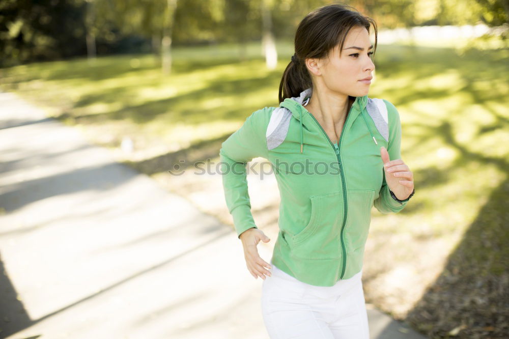 Similar – Athletic Woman in Running Exercise at the Park