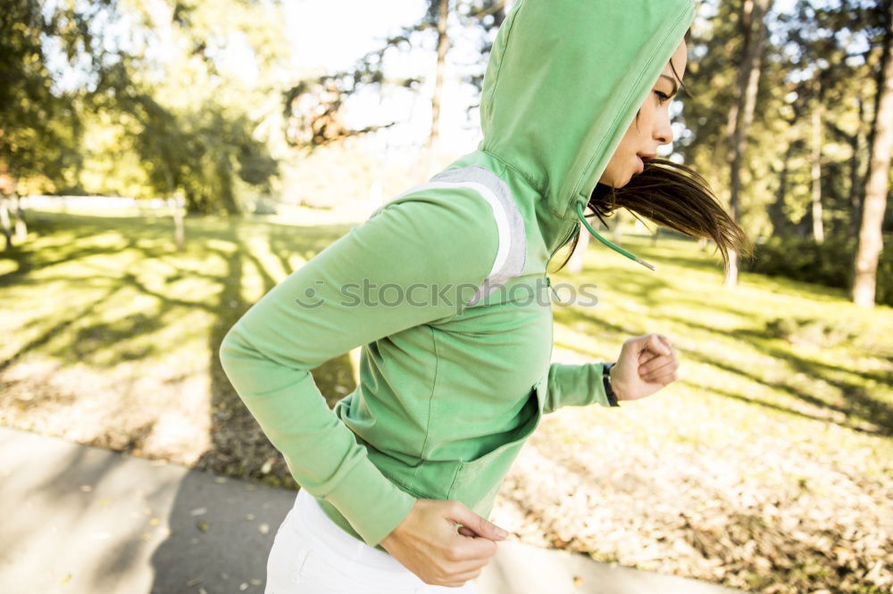 Similar – Woman tying hair in ponytail getting ready for run.