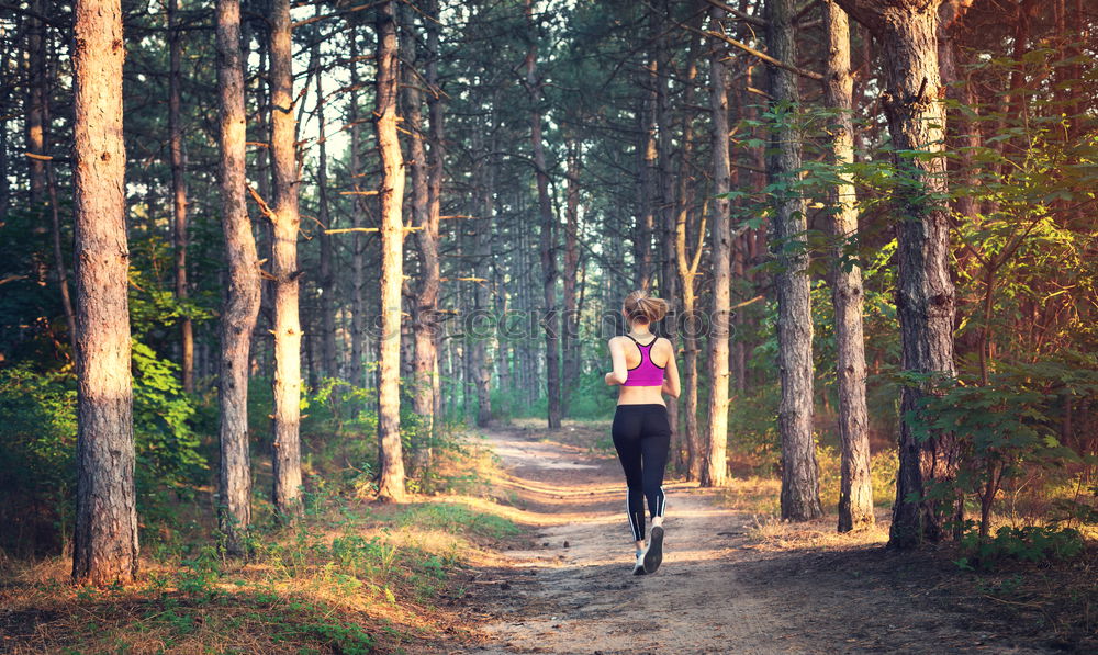 Similar – Image, Stock Photo Athletic woman out jogging in a forest