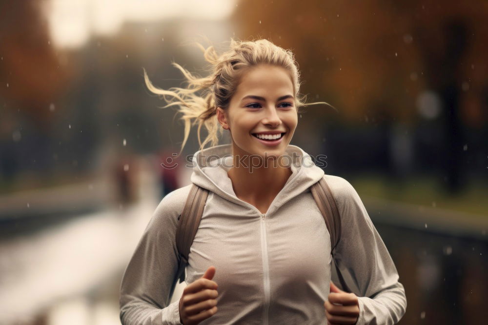 Similar – Pretty Woman Jogging at the Park with Headphones