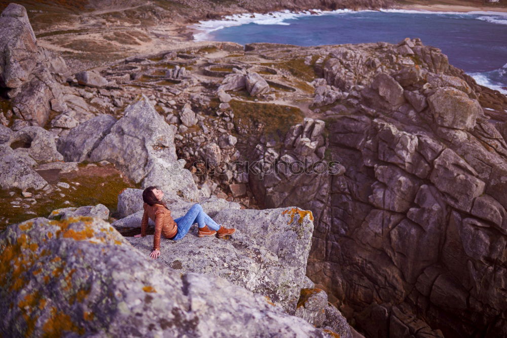 Image, Stock Photo Young woman over a cliff in a celtic ruins in Galicia