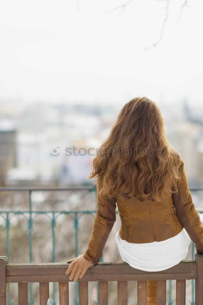 Similar – Young woman on a swing on a playground