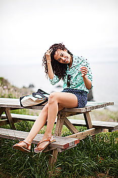 Similar – Young black woman with afro hairstyle sitting on a bench