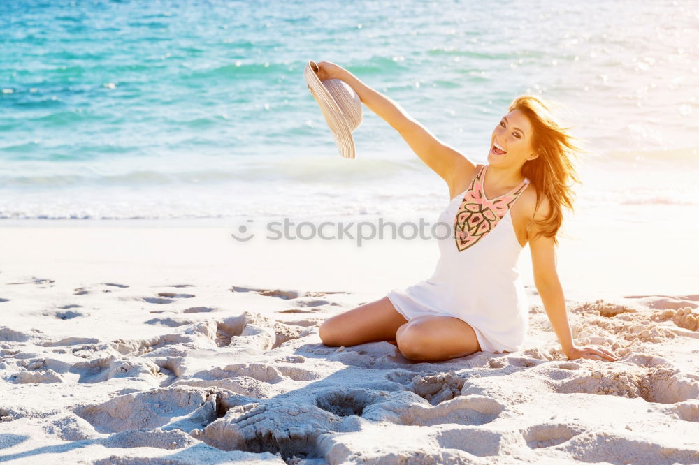 Similar – Fit female athlete drinking water after workout on beach