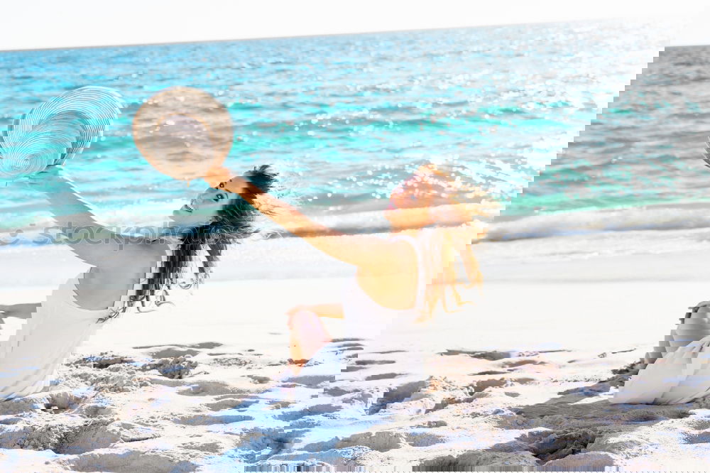 Similar – Image, Stock Photo young girl in a straw hat on the background of the sea
