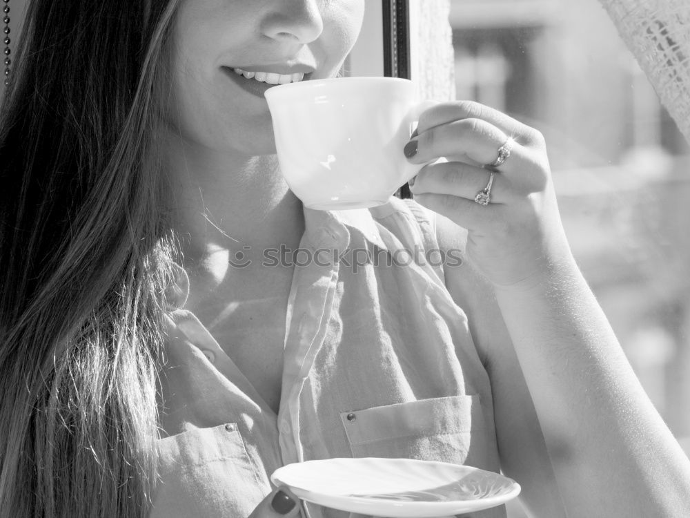 Similar – beauty girl sitting in a coffee shop with a cup in her hands