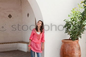 Similar – Young woman in yellow dress walking by the city