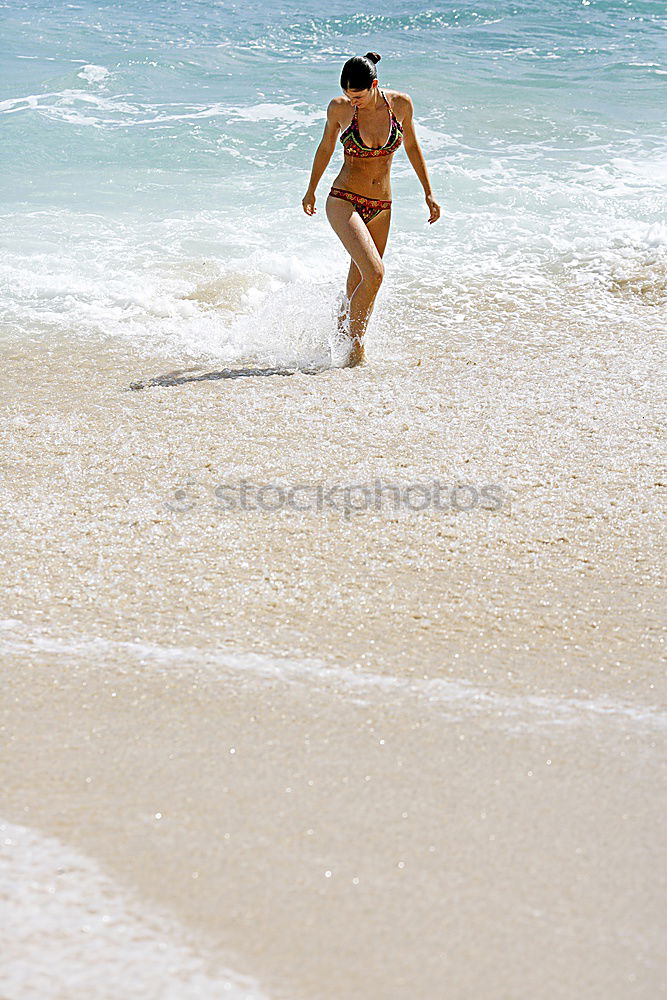 Similar – Man walking on the beach