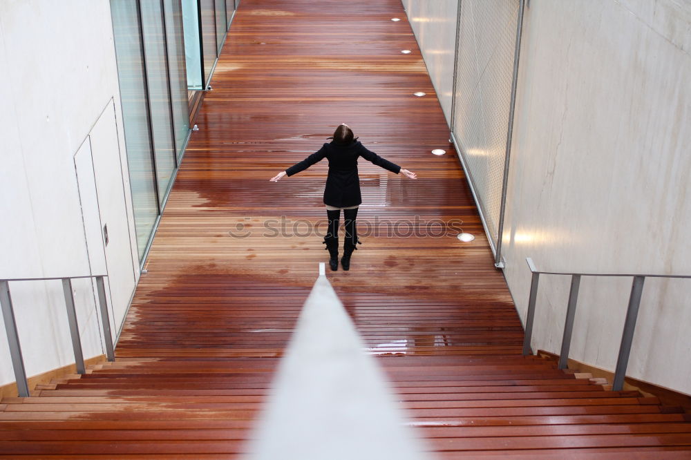 Similar – Trendy girl posing on stairs