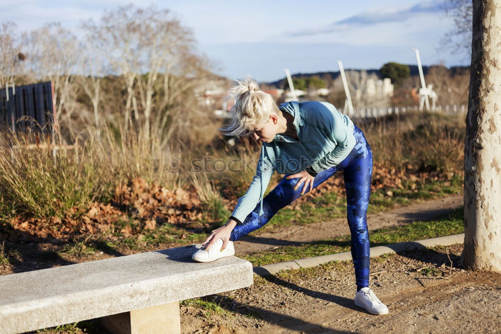 Similar – Image, Stock Photo blonde woman sitting in the grass and stretching in a park