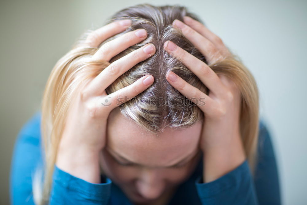 Similar – Young woman rubbing her eyes