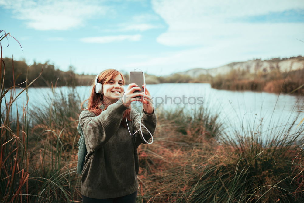 Similar – Blonde white woman holding an old VHS tape and playing with it.