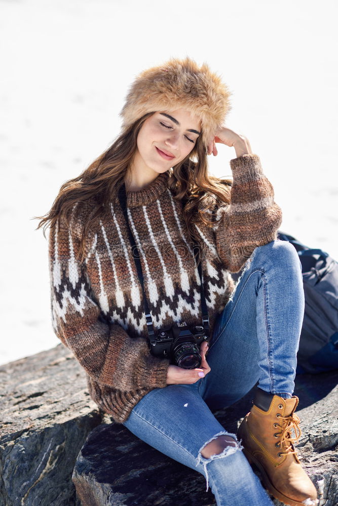 Similar – young woman 30 years in snow with red coat and leopard dress blond hair curly happy hopeful street