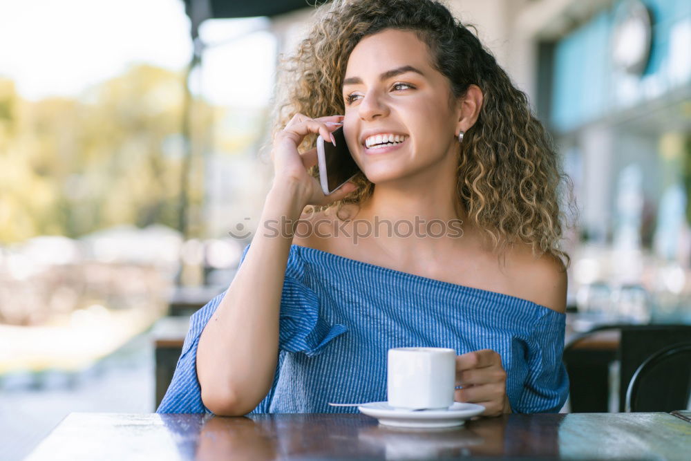 Similar – Woman posing sitting in outside cafe