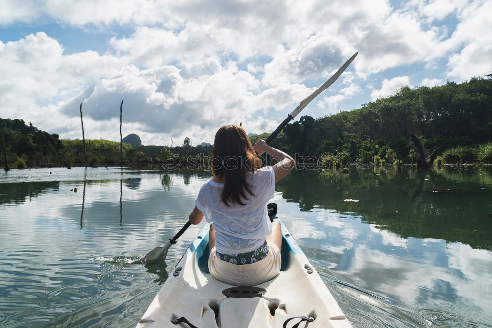 Similar – Unrecognizable woman on kayak exploring river