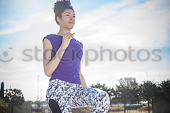 Similar – Woman tying hair in ponytail getting ready for run.