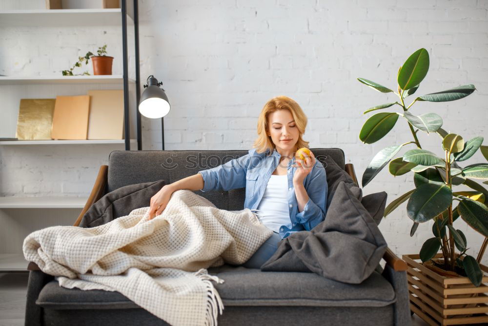 Similar – Image, Stock Photo young woman sitting on her diy couch with phone