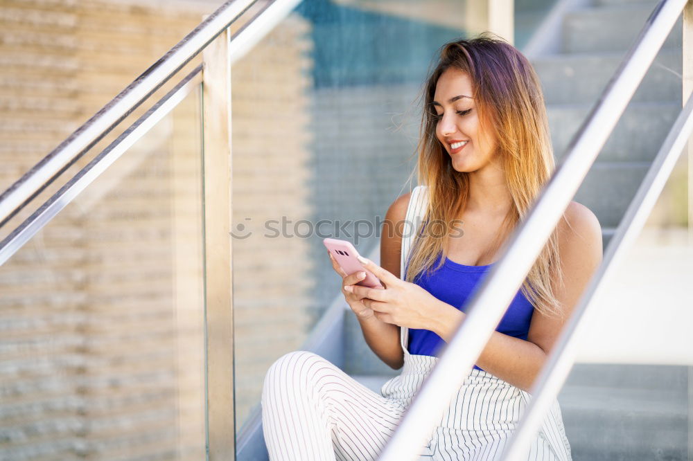 Similar – Image, Stock Photo Sporty young woman sitting on forecourt with her mobile