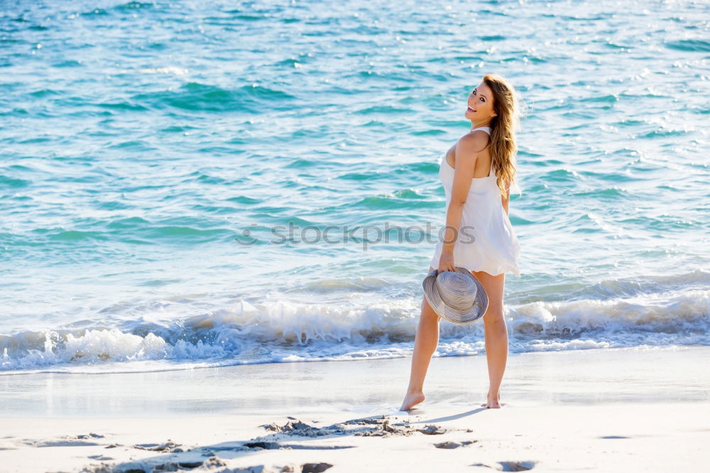 Similar – Asian woman standing on the terrace and looking around the sea.