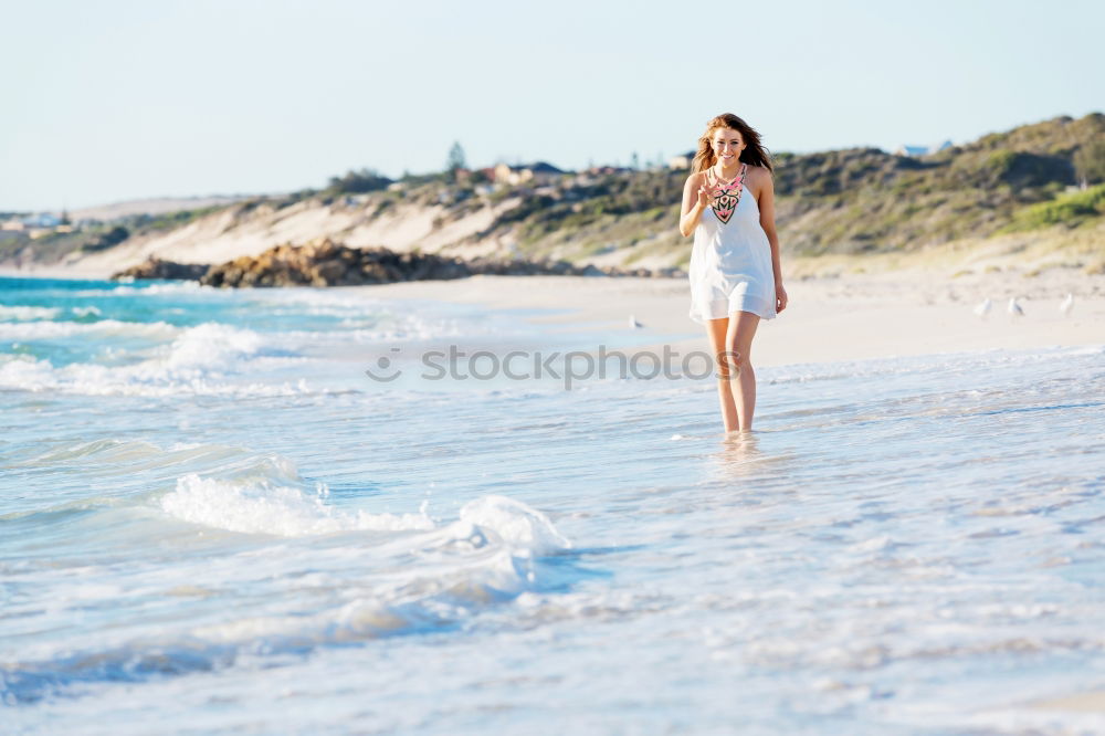 Similar – Image, Stock Photo caucasian mother and sun are walking into the water at the beach