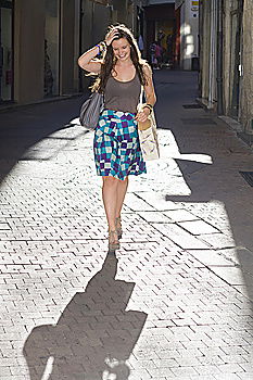 Similar – Image, Stock Photo Woman with long brunette waving hair and pink dress dancing barefoot on a large paved square against the light