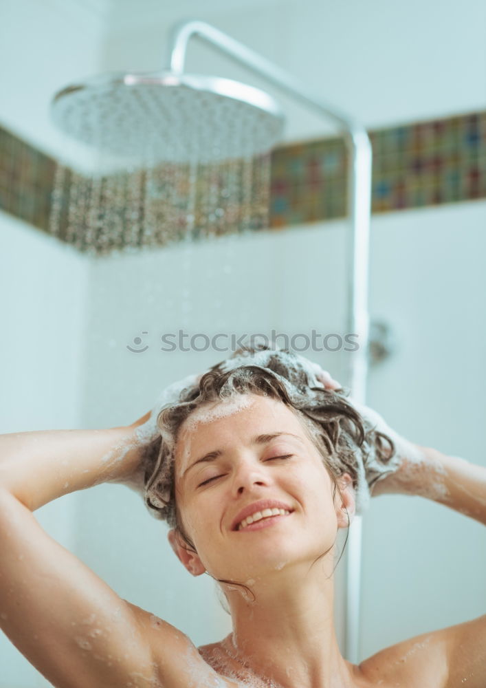 Similar – Young woman reacting in shock under shower