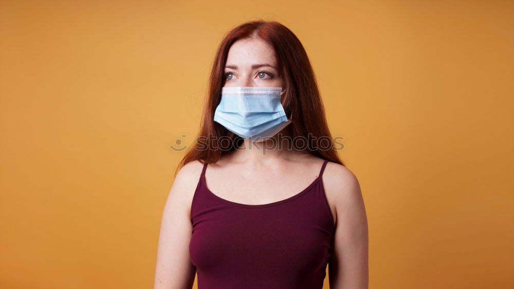 young woman who is wearing a mask under her nose in the wrong way