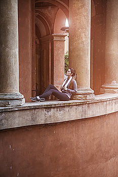 Similar – Image, Stock Photo Young woman standing on the balcony of an old building