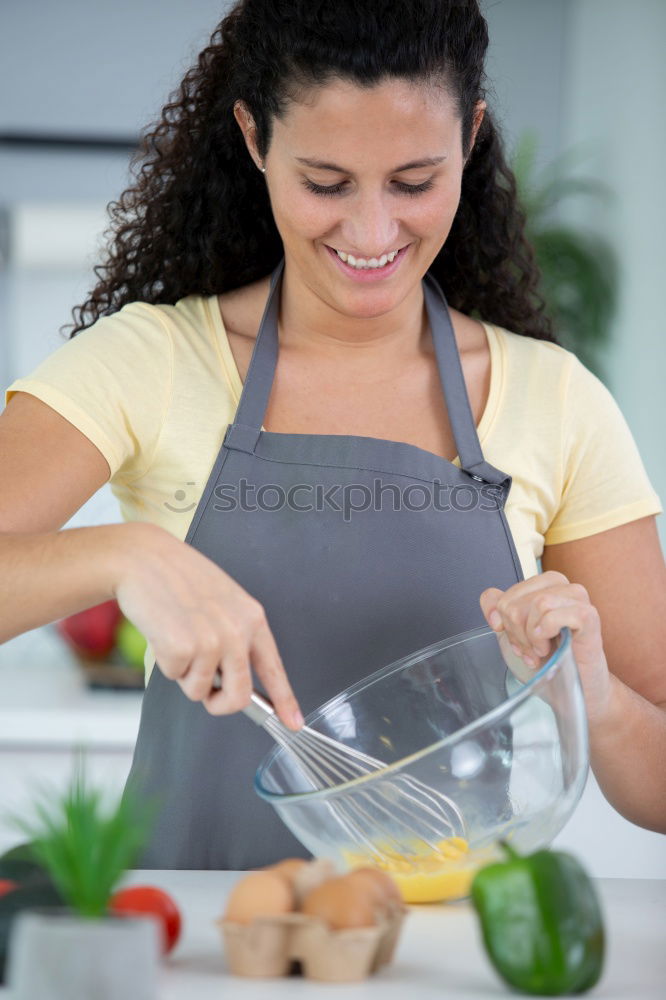 Similar – Young couple cooking. Man and woman in their kitchen