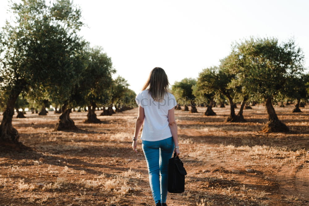 Similar – Image, Stock Photo Young woman is packing her backpack during hiking in summer nature. Concepts of adventure, extreme survival, orienteering. Equipments for hike.