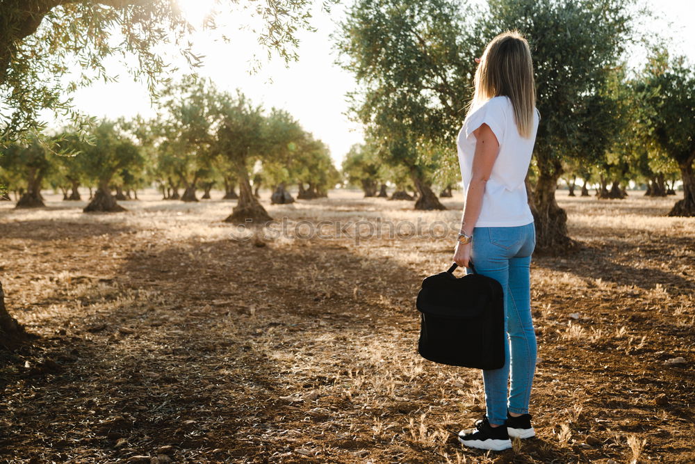 Similar – Image, Stock Photo Young woman is packing her backpack during hiking in summer nature. Concepts of adventure, extreme survival, orienteering. Equipments for hike.