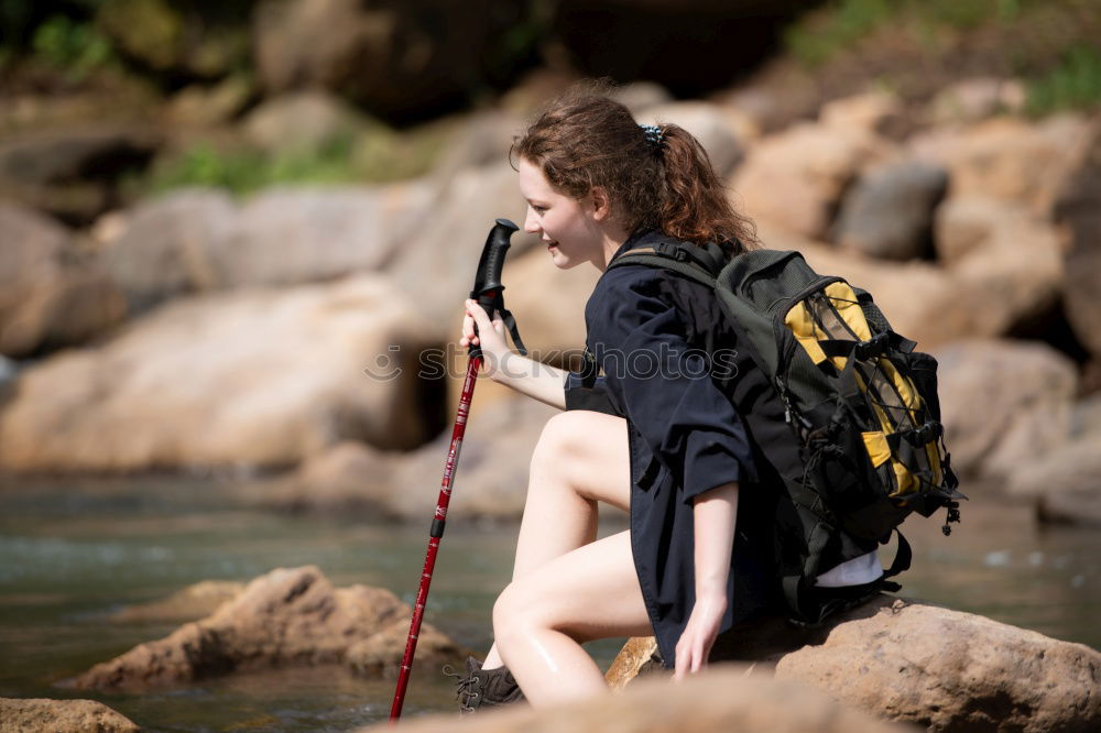 Similar – Young boy taking pure water from a river