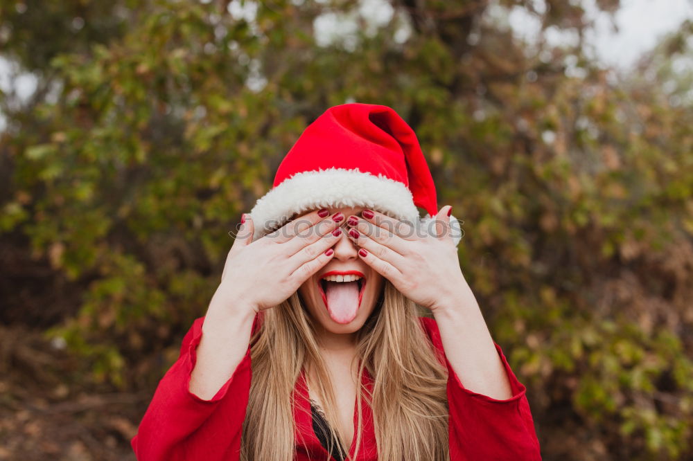 Similar – Image, Stock Photo Young woman with Christmas hat in the forest