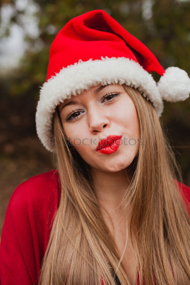 Similar – Image, Stock Photo Young woman with Christmas hat in the forest