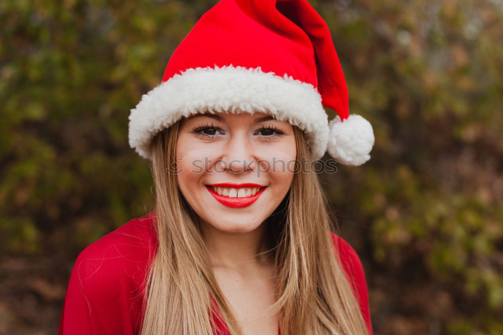 Similar – Image, Stock Photo Young woman with Christmas hat in the forest