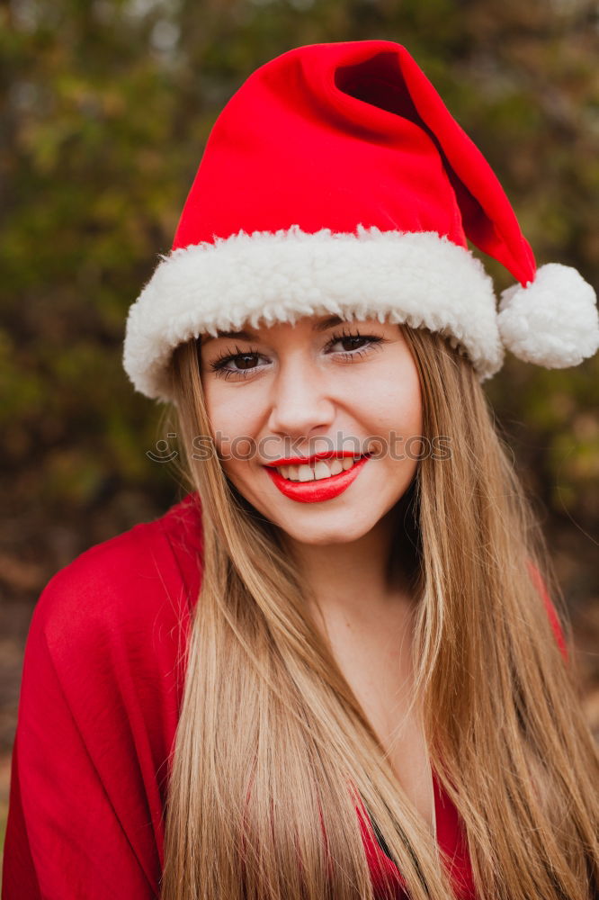 Similar – Image, Stock Photo Young woman with Christmas hat in the forest