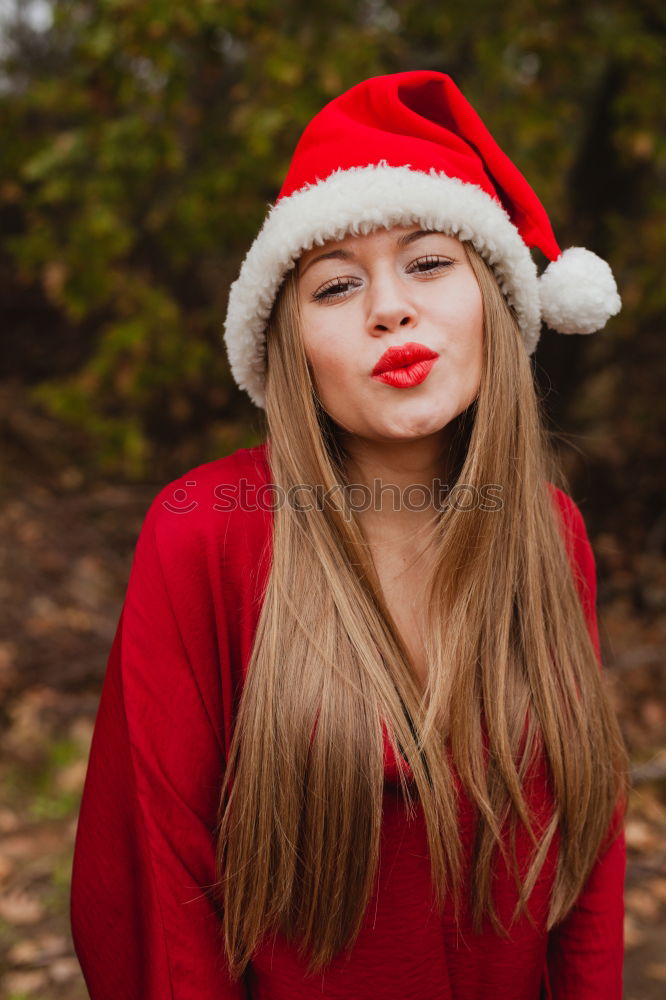 Similar – Image, Stock Photo Young woman with Christmas hat in the forest